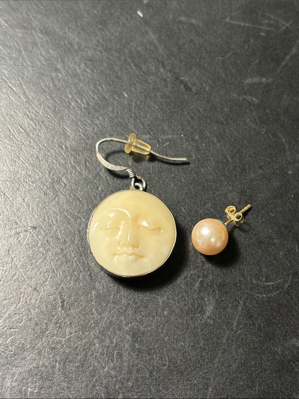 Face and pearl stud earrings